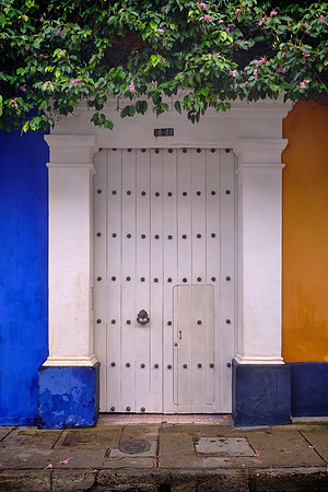 Buildings are marked by baroque altars, carved wooden doors, and elaborate courtyards.