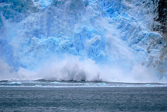 Glaciar Garibaldi calving, Agostini National Park, Chilean Fjords --- chunks of ice the size of a school bus make a big splash.