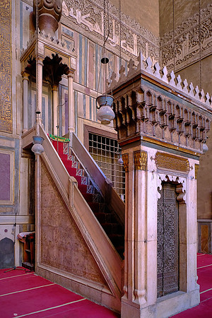 A minbar is a pulpit in a mosque where the imam stands to deliver sermons.