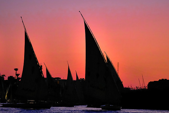 Sailboats on the Nile River at sunset.