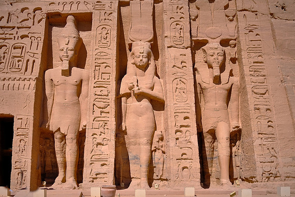 This is one of very few instances in Egyptian art where the statues of the king and his consort (middle) have equal size.