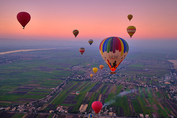 Early morning balloon ascension over the plains of Luxor.