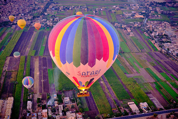 Early morning balloon ascension over the plains of Luxor.