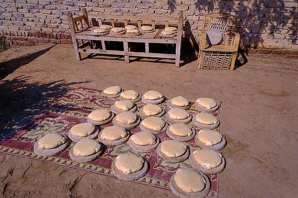 We visited local families who were baking bread.