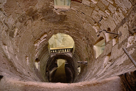 A circular staircase leads to the tombs tunneled into the bedrock during the age of the Antonine emperors (2nd century AD).