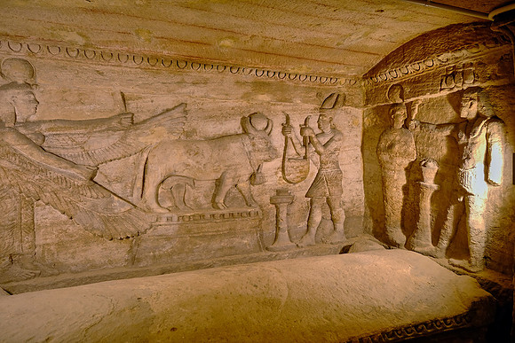 One of three huge stone sarcophagi with non-removable covers along the sides of the chamber.