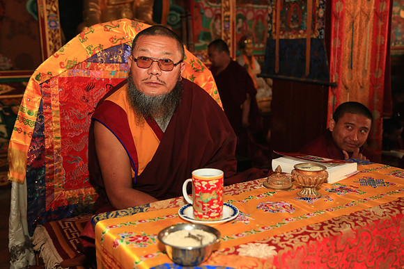 Bhikshu (high Buddhist priest) in prayer session, Boudhanath Stupa, Kathmandu, Nepal