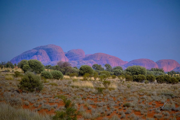 Kata Tjuta is a collection of 36 massive rock domes located west of Uluru in Uluṟu-Kata Tjuṯa National Park.