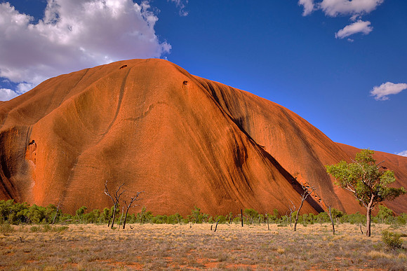Erosion stripped away surrounding softer material exposing the steep domes that rise over 3,500 feet.
