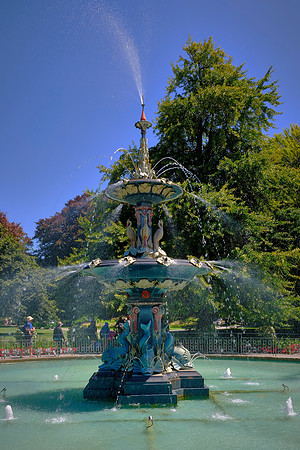 This fountain is a rare example of ornate Edwardian design, featuring elaborate cast iron and vibrant color.
