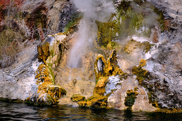 Around Inferno Crater Lake's shores, a crypto-geyser operates intermittently at the lake bottom.