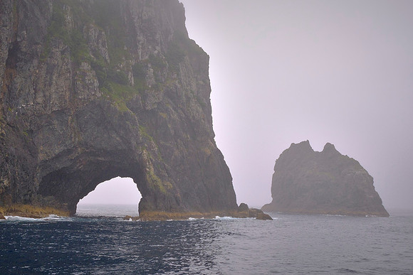 Also popular are sailing to Hole-in-the-Rock (shown here), dolphin cruises, kayaking, and kauri forest hikes.
