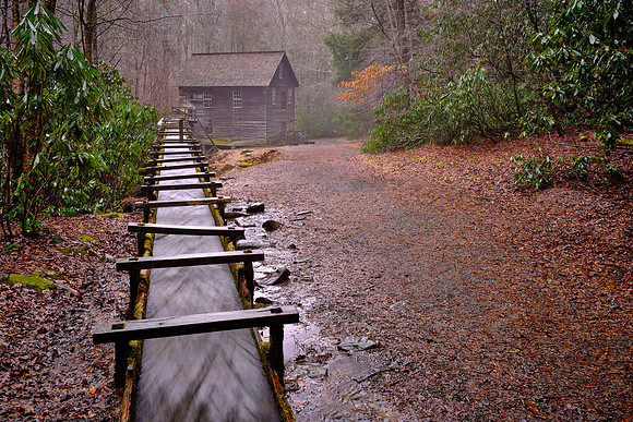The grist mill uses a water-powered turbine  instead of a water wheel to power the machinery in the building.