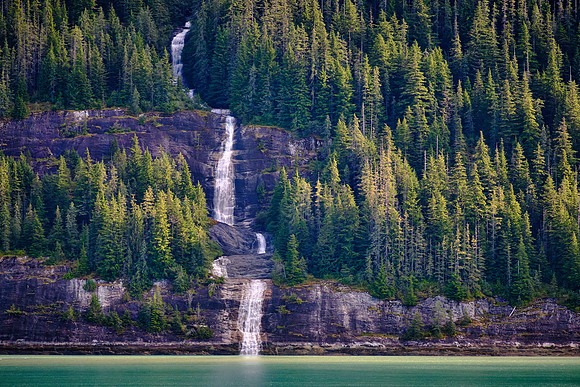 Granite walls rise 4,000 to 6,000 feet straight out of the water and are blanketed by cascading waterfalls.