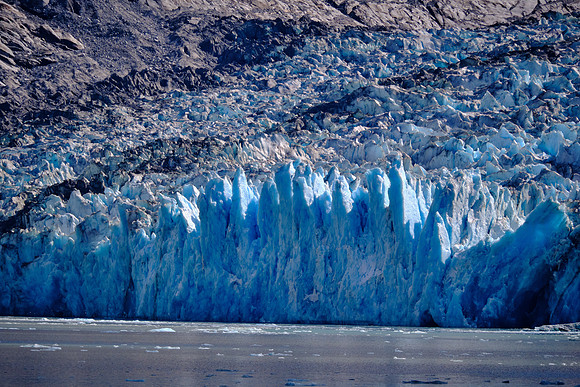 The last few decades have triggered a massive and accelerating retreat of the Dawes Glacier.