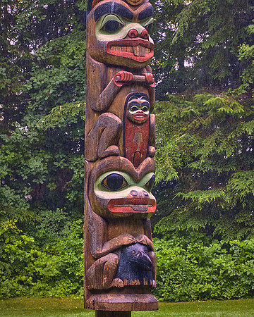 The 20 totem poles blend historic 19th-century monuments with contemporary works.