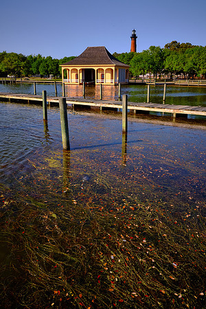 The boathouse at the Whalehead Club and the Currituck Beach Lighthouse, Corolla, NC