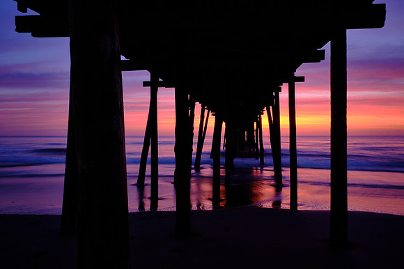 Sunrise over the Atlantic Ocean and Nags Head Fishing Pier, NC