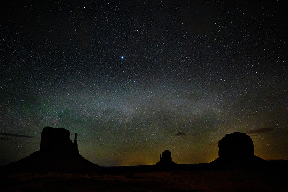 The Milky Way over the West Mitten Butte, East Mitten Butte, and Merrick Butte, Monument Valley, UT.  This evening cloud restricted Milky Way photography.