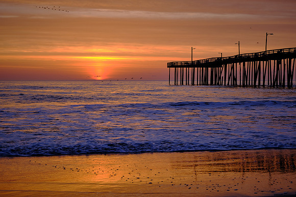 Sunrise over the Atlantic Ocean and Nags Head Fishing Pier, NC