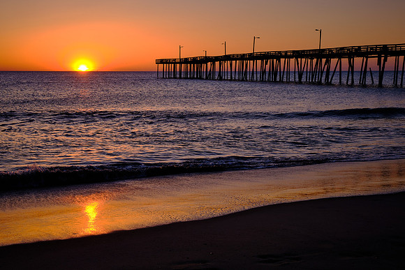 Sunrise over the Atlantic Ocean and Nags Head Fishing Pier, NC