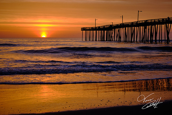 Sunrise over the Atlantic Ocean and Nags Head Fishing Pier, NC