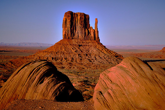 Monument Valley, UT.  West Mitten Butte at sunset with Ansel Adams rocks in foreground.