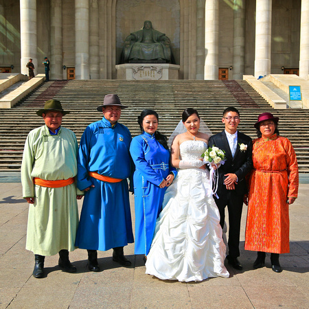 Wedding party in front of large monument to Genghis Khan, Ögedei Khan, and Kublai Khan, completed in 2006 in time for the 800-year anniversary of Genghis Khan's coronation.