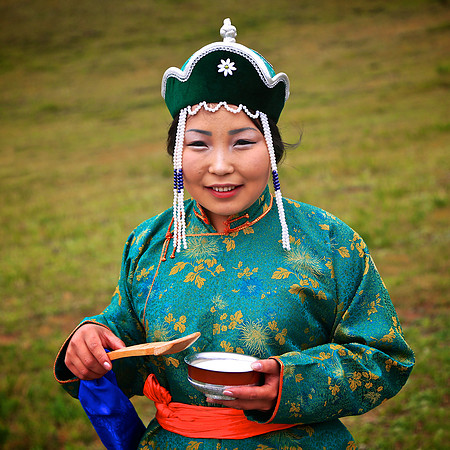 We are greeted by Mongol good-luck tradition of flipping milk around.