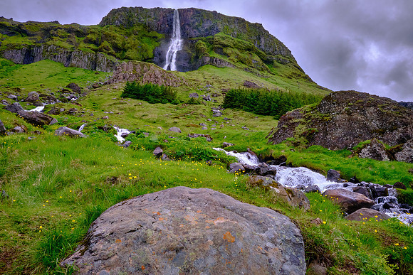 Bjarnarfoss waterfall along the coastline of Arnarstapi on the Snæfellsnes Peninsula.