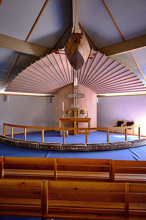 Note the Inuit fishing boat over the alter.