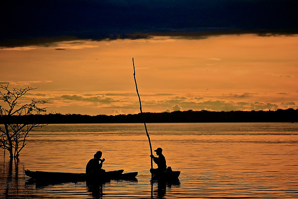 2011 May 10.  Fisherman at sunset over Amazon River, Peru.