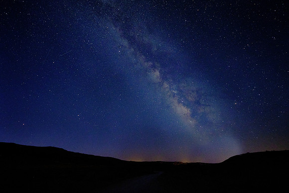 The Milky Way at sunrise, Mexican Hat, UT.  This image was taken about an hour into Astronomical Twilight.  Sunlight from below the horizon illuminated the sky a bright blue.
