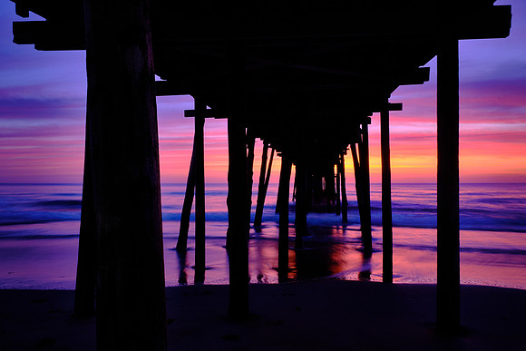 Sunrise over the Atlantic Ocean and Nags Head Fishing Pier, NC