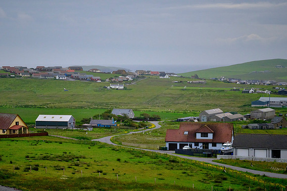Shetland's area is 566 sq mi with a population of 22,986 in 2022.