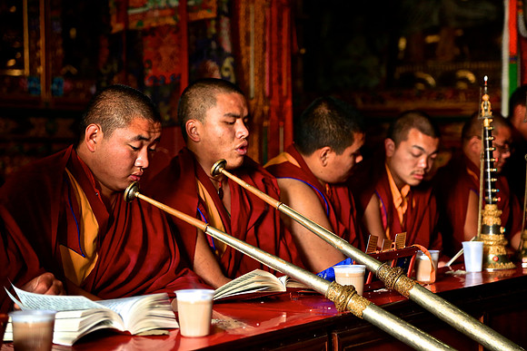 Monks in prayer session, Boudhanath Stupa, Kathmandu, Nepal
