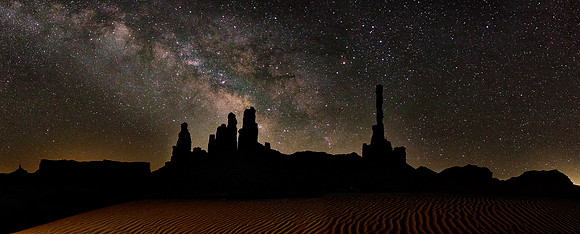 The Milky Way over the Totem Pole, Monument Valley, UT.  At the Galactic Center is a supermassive black hole of about 4 million solar masses.
