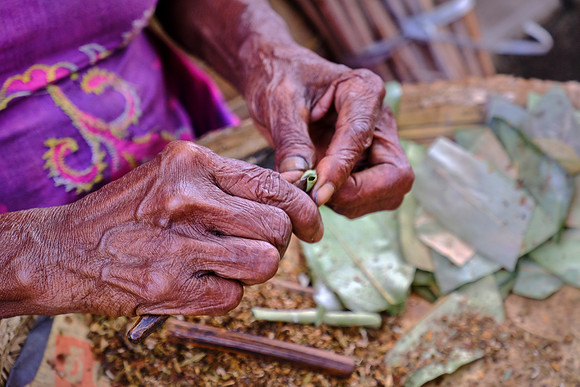 Roadside cigarette manufacturing firm at work, Sri Lanka