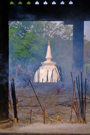 Incense offering and Buhhdist stupa at The Temple of the Sacred Tooth Relic, Kandy, Sri Lanka