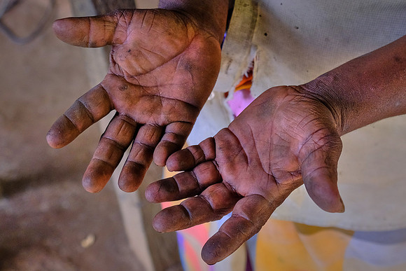 Hands of a roadside blacksmith on the way to Matara, Sri Lanka