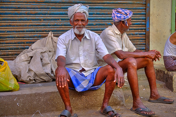 Two observers of street commerce in Kancheepuram.