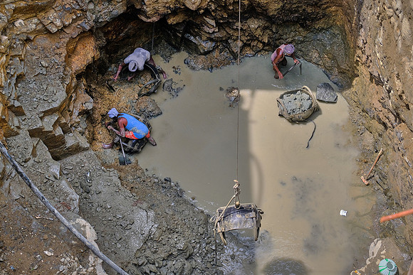 Excavating the foundation for new construction.