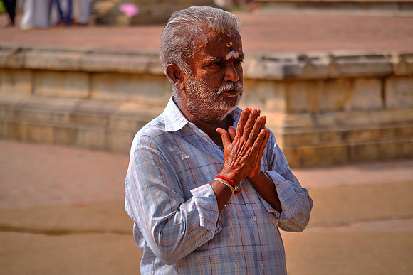 Pilgrim in worship at the Brihadishvara Temple.