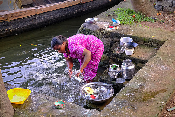 Washing dishes on the Kerala Backwater