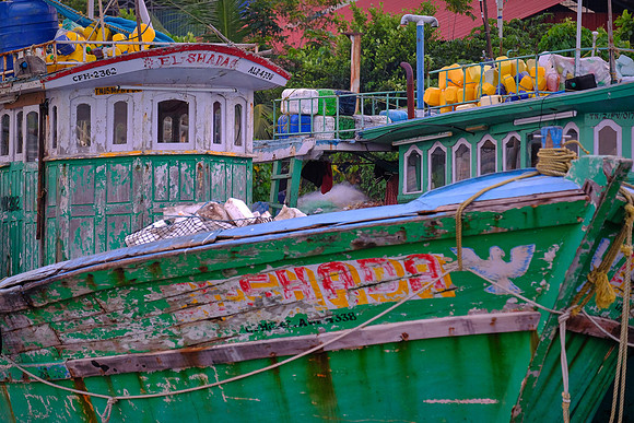 Fishing boats along the shore of Kochi, India.