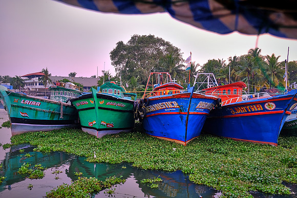 Fishing boats along the shore of Kochi, India.
