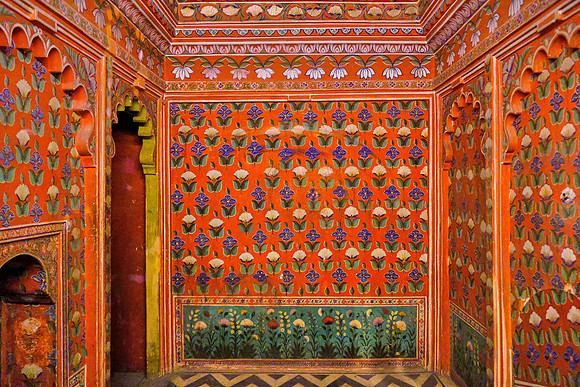 Small interior red room in the City Palace, Udaipur, Rajasthan, India.