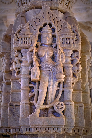 The temple has an intrinsic architecture and is famous for erotic arts on the wall. Ranakpur Jain Temple, Rajasthan, India.