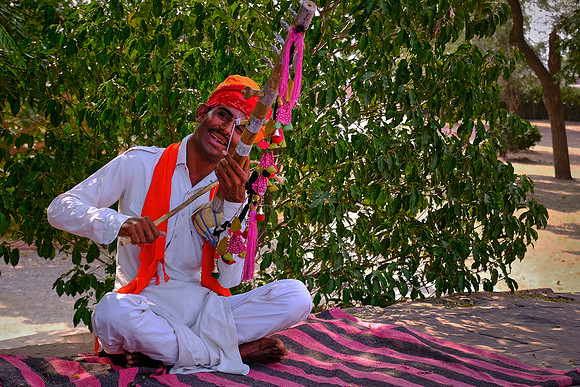Lone fiddler outside the Jaswant Thada, Jodhpur, Rajasthan, India.
