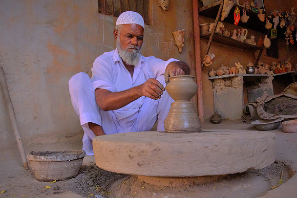 Throwing pots in rural Rajasthan, India.